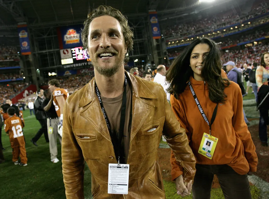 Actor Matthew McConaughey and girlfriend Camila Alves celebrate after the Texas Longhorns defeated the Ohio State Buckeyes in the Tostitos Fiesta Bowl Game on January 5, 2009 at University of Phoenix Stadium in Glendale, Arizona. 