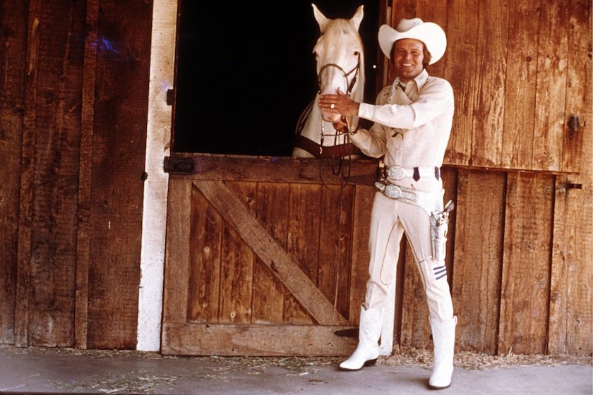 Posed portrait of Glen Campbell, with horse Posed portrait of Glen Campbell, with horse