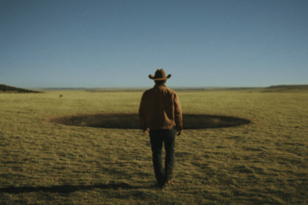 Description: Josh Brolin (Royal Abbott) walking up to a black hole in a scene from 'Outer Range'