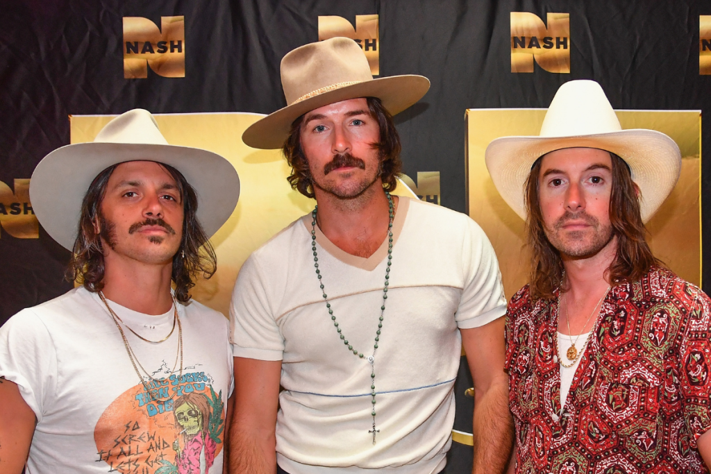 (L-R) Cameron Doddy, Mark Wystrach and Jess Carson of the band Midland gather for a photo backstage at Cannery Ballroom on June 5, 2018 in Nashville, Tennessee.