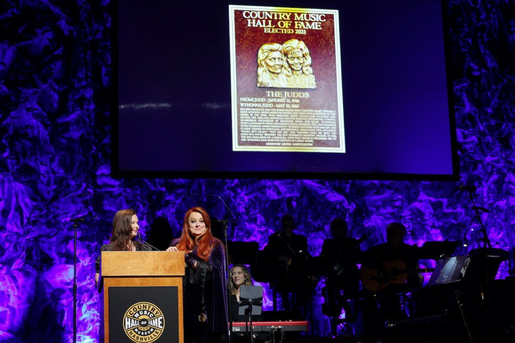 NASHVILLE, TENNESSEE - MAY 01: (L-R) Ashley Judd and inductee Wynonna Judd speak onstage for the class of 2021 medallion ceremony at Country Music Hall of Fame and Museum on May 01, 2022 in Nashville, Tennessee.