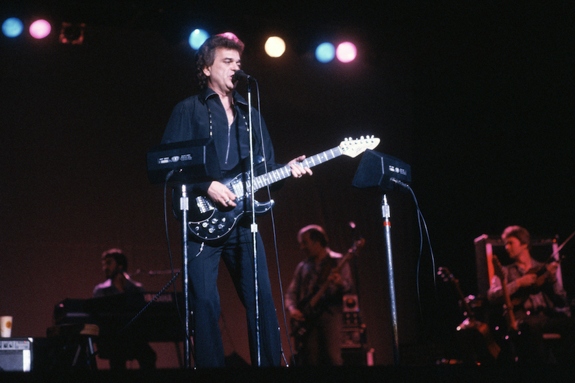(Original Caption) Country Western singer Conway Twitty and "The Twitty Birds" perform in concert at a theatre in Richmond, VA. 