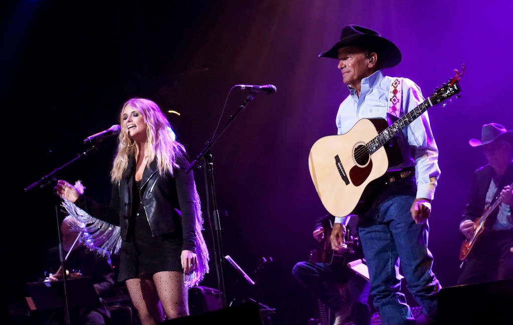 Miranda Lambert (L) and George Strait perform onstage during George Strait's Hand in Hand Texas benefit concert; Strait and special guests Miranda Lambert, Chris Stapleton, Lyle Lovett and Robert Early Keen perform in concert at the Majestic Theatre on September 12, 2017 in San Antonio, Texas.