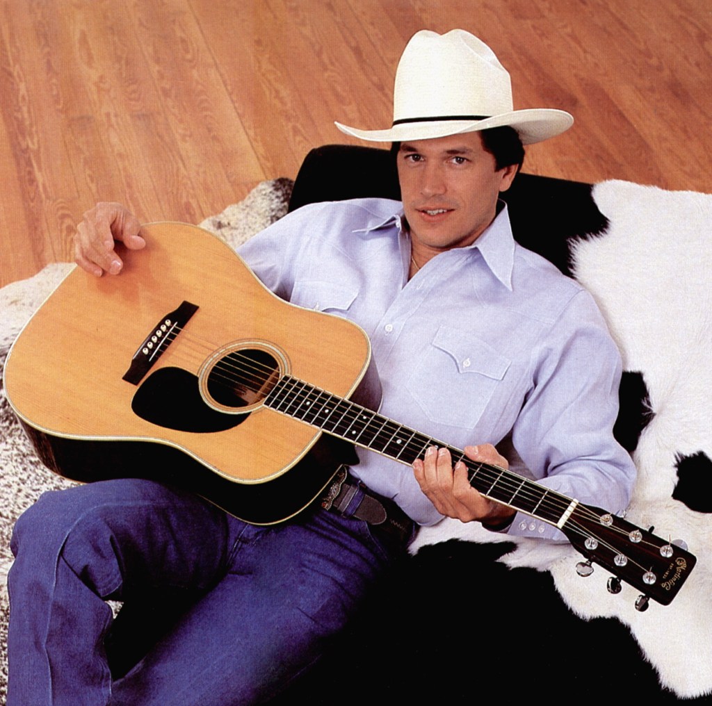 George Strait poses with guitar