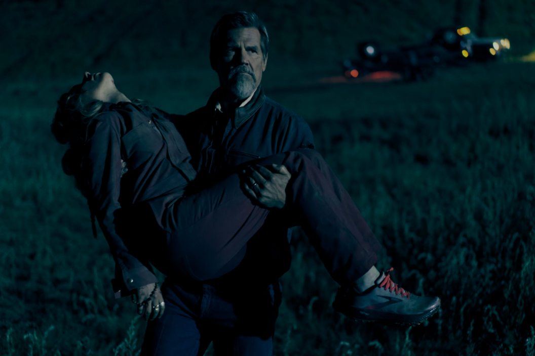 Josh Brolin carries Imogen Poots in a scene from 'Outer Range'
