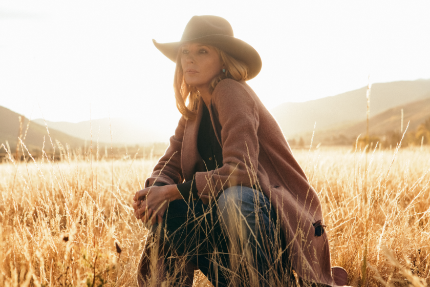 Kelly Reilly in a field wearing a cowboy hat in a scene from 'Yellowstone'