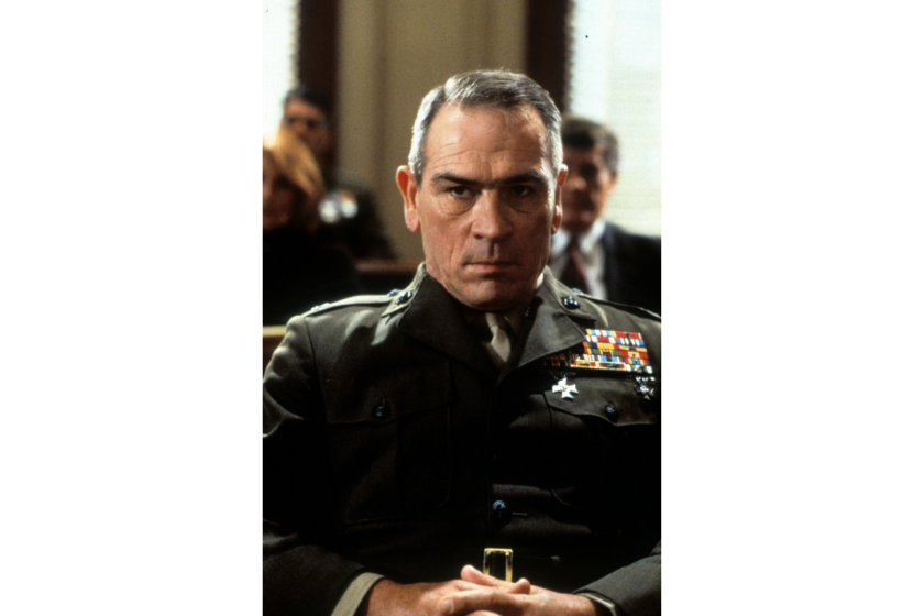Tommy Lee Jones sitting sternly in a scene from the film 'Rules Of Engagement', 2000