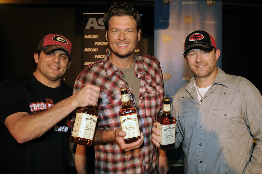NASHVILLE, TN - SEPTEMBER 08: Five time 2011 CMA awards nominee, Recording Artist Blake Shelton (center) celebrates at The BMI #1 Party for Blake Shelton's "Honey Bee" Co-writers Rhett Akins (left) and Ben Hayslip (right) at the offices of Warner Brothers Nashville on September 8, 2011 in Nashville, Tennessee.
