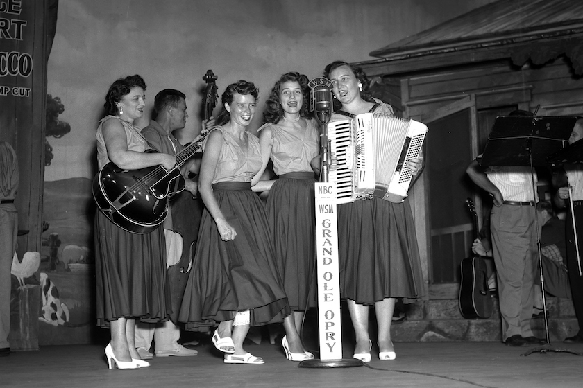 Country singer songwriters The Carter Family (Maybelle Carter on Guitar, Helen Carter on accordion, Ernie Newton on Bass with dancers June Carter Cash and Anita Carter) on stage at the Grand Ole Opry in 1951 in Nashville, Tennessee. 