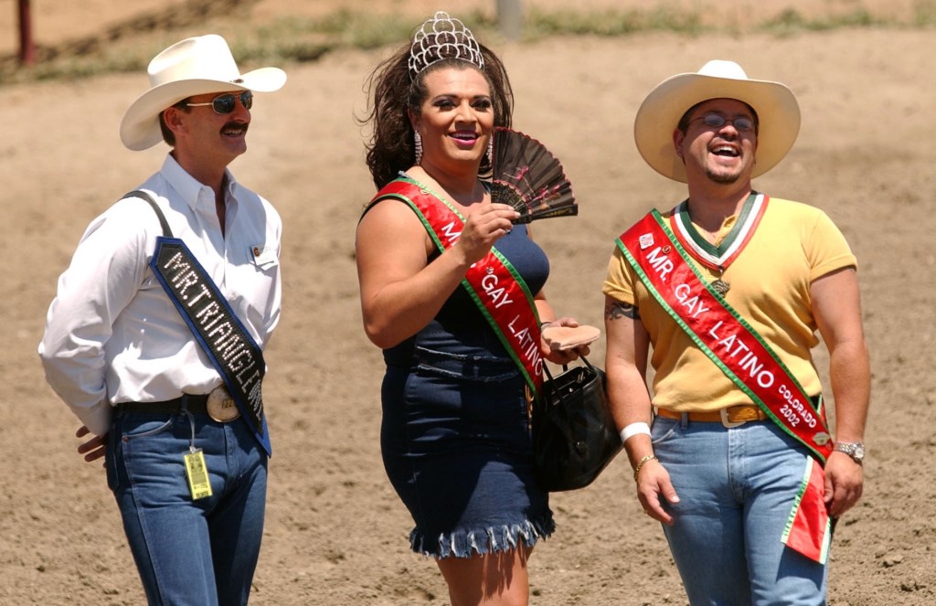 From left, John Carroll, Marlena DiMarco and Michael Villarini of Colorado Gay Rodeo Association are in the grand entry of CGRA's Rocky Mountain Regional Rodeo at Jefferson County Fairground on Saturday. 
