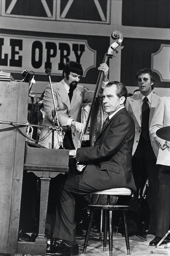 NASHVILLE, TN - MARCH 16: (NO U.S. TABLOID SALES) U.S. President Richard Nixon plays the piano during the dedication of the Grand Ole Opry March 16, 1974 in Nashville, Tennessee. 