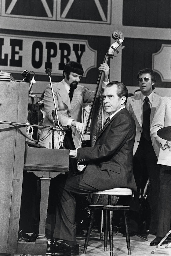 NASHVILLE, TN - MARCH 16: (NO U.S. TABLOID SALES) U.S. President Richard Nixon plays the piano during the dedication of the Grand Ole Opry March 16, 1974 in Nashville, Tennessee.