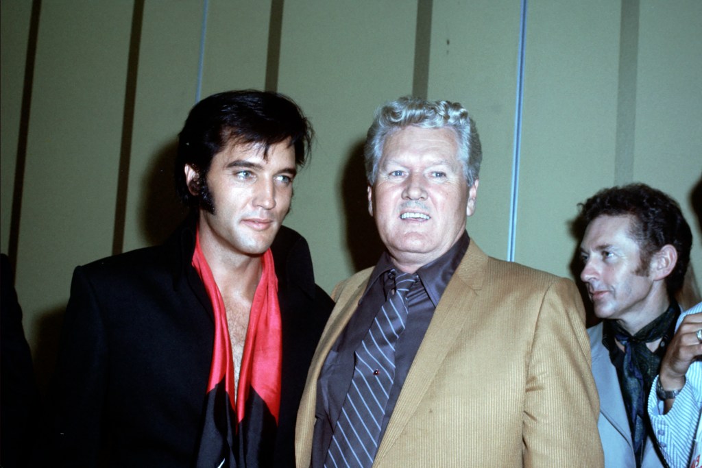  Rock and roll musician Elvis Presley and his father Vernon Presley during a press conference after his first performance at the International Hotel on August 1, 1969 in Las Vegas, Nevada.