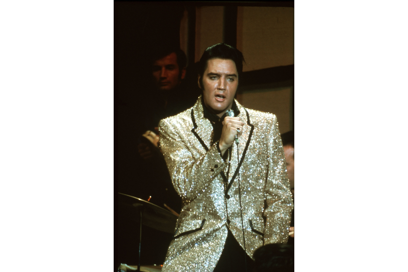 Rock and roll musician Elvis Presley performing the song "Trouble" on the Elvis comeback TV special on June 27, 1968 in Burbank, California