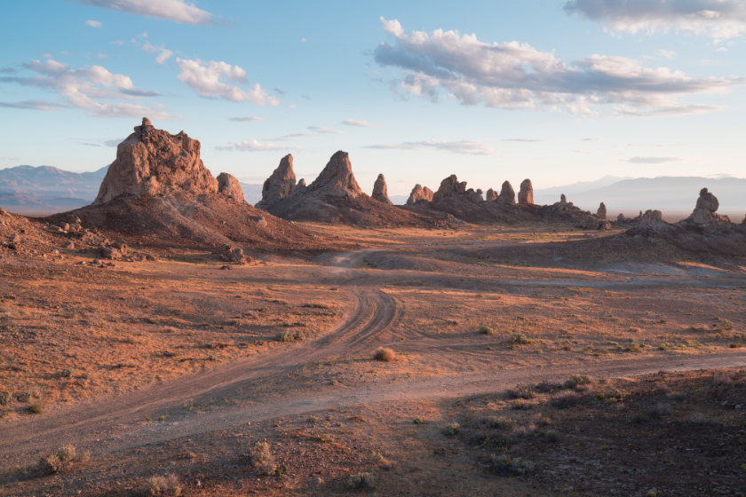 Trona Pinnacles are nearly 500 tufa spires hidden in California Desert National Conservation Area, not far from the Death Valley National Park, California, USA. Sunset landscape with beautiful rocks