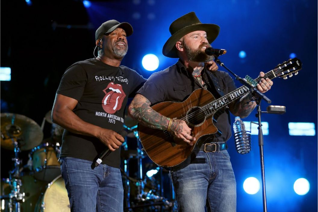 (L-R) Darius Rucker and Zac Brown of Zac Brown Band perform during day 1 of CMA Fest 2022 at Nissan Stadium on June 09, 2022 in Nashville, Tennessee