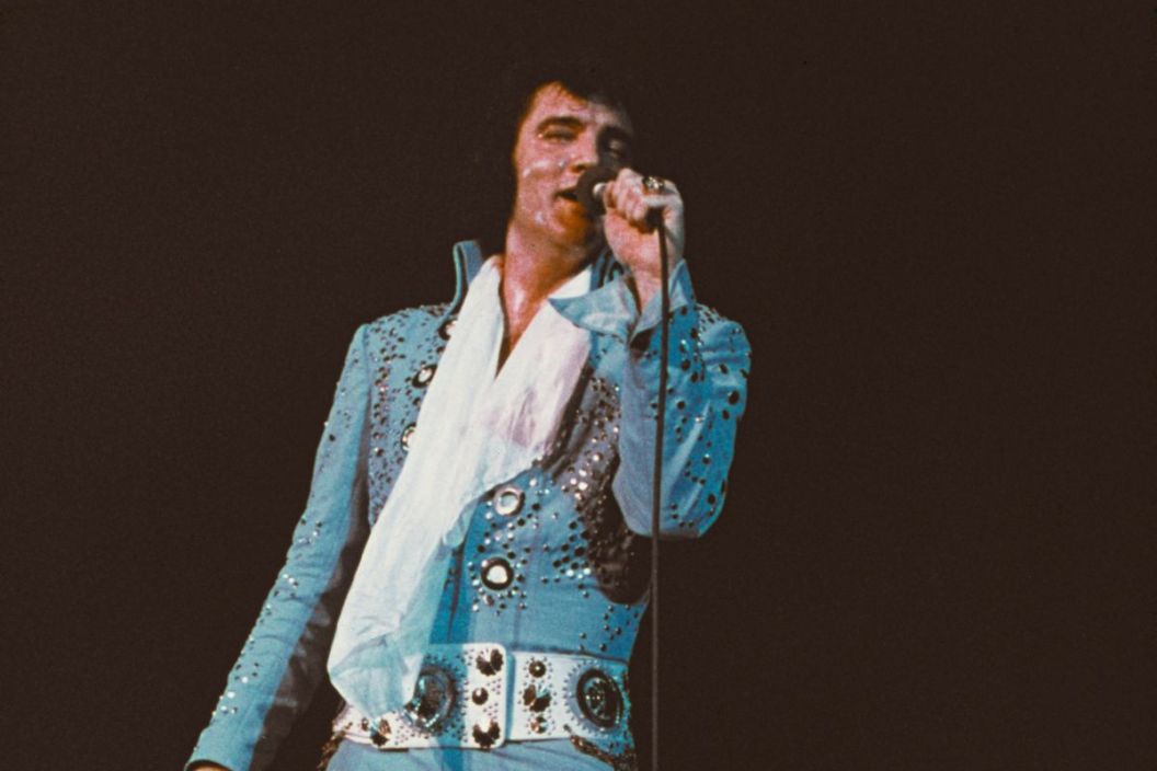 American singer Elvis Presley (1935 - 1977) performing on stage, circa 1972.