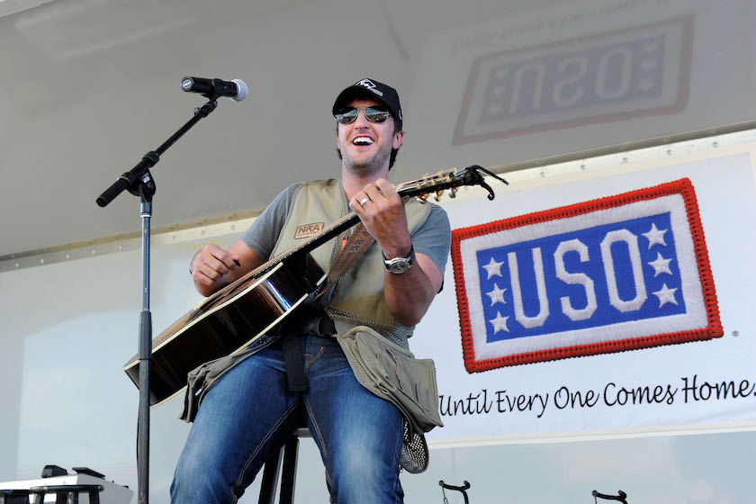 LAS VEGAS, NV - APRIL 02: Musician Luke Bryan performs at the 2nd Annual Academy of Country Music USO Concert at Nellis Air Force Base on April 2, 2011 in Las Vegas, Nevada.