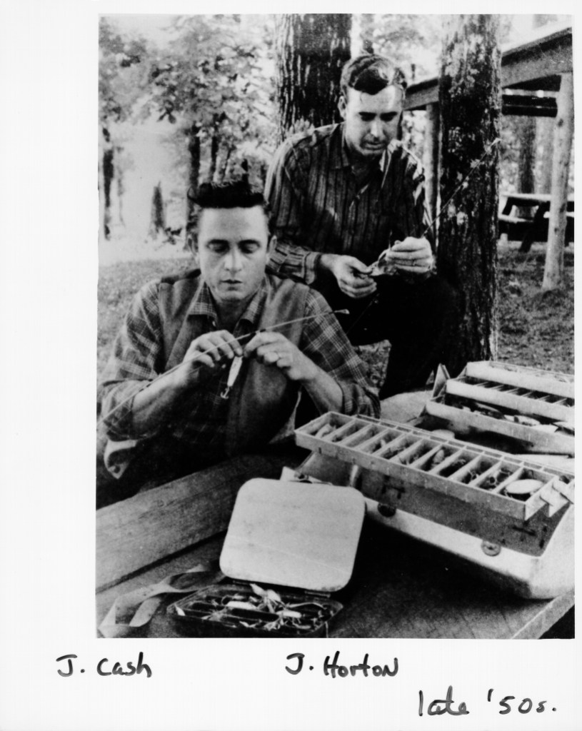 KINGSLAND, AR - MAY 1959: Country singer/songwriters Johnny Horton and Johnny Cash bait fish hooks in May 1959 in Kingsland, Arkansas. 