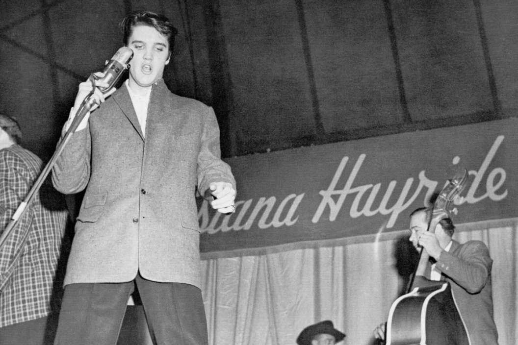 1954: Rock and roll singer Elvis Presley with his bass player Bill Black on tour with the Louisiana Hayride show in 1954.