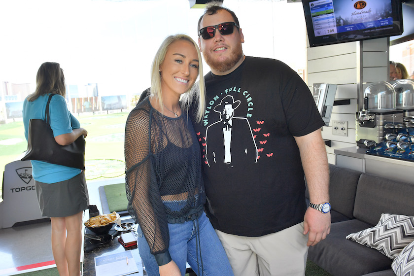 LAS VEGAS, NEVADA - APRIL 06: (L-R) Nicole Hocking and Luke Combs attend the ACM Lifting Lives TOPGOLF Tee-Off at TOPGOLF on April 06, 2019 in Las Vegas, Nevada. 