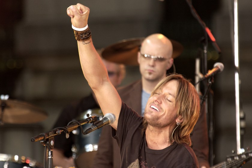New Zealander-Australian Country and Pop musician Keith Urban plays acoustic guitar as he performs onstage during ABC Television's 'Good Morning America' at Rumsey Playfield, Central Park, New York, New York, August 12, 2005.