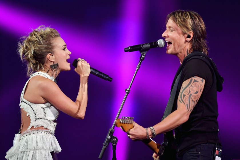 NASHVILLE, TN - JUNE 07: Carrie Underwood (L) and Keith Urban (R) perform onstage during the 2017 CMT Music Awards at the Music City Center on June 7, 2017 in Nashville, Tennessee. 