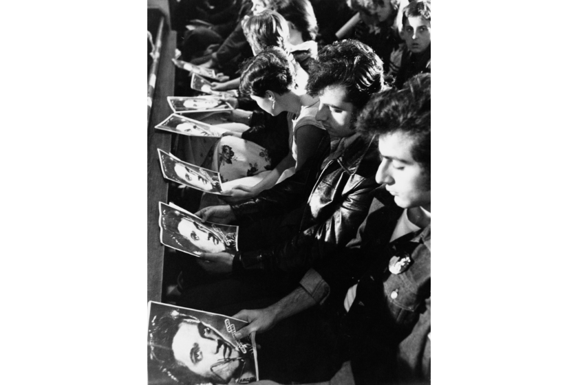 Fans with special prayer sheets at a memorial service for Elvis Presley held in London three days after the singer's death, 18th August 1977