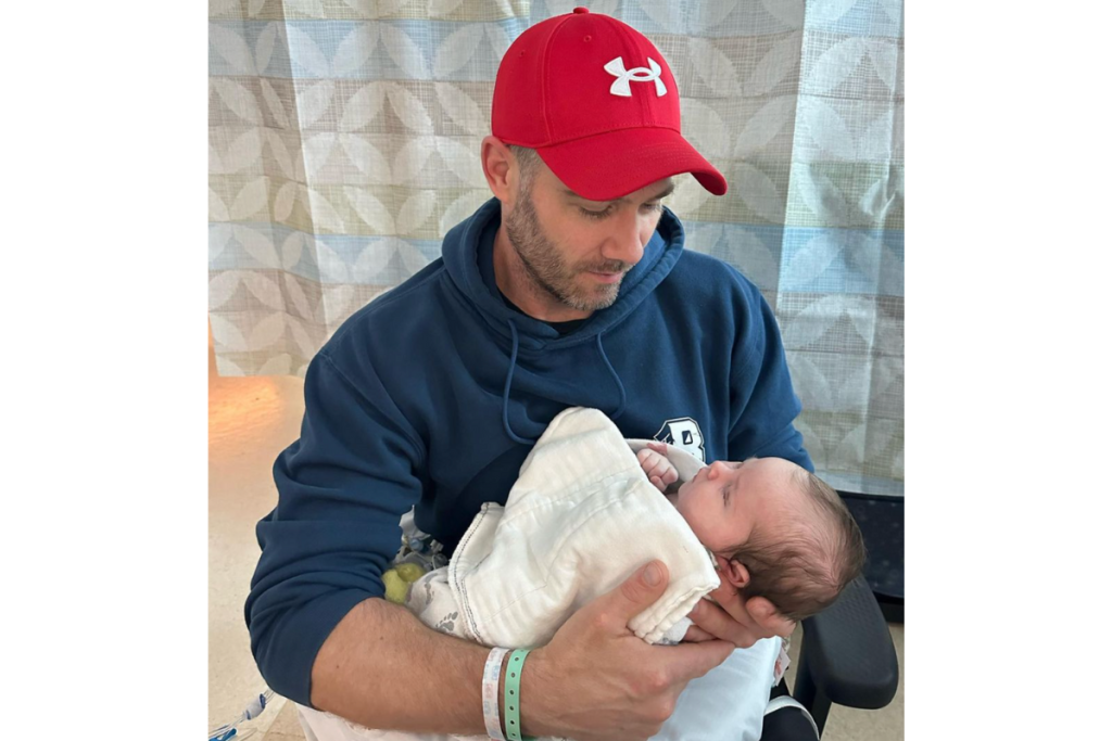 Luke Macfarlane and his newborn daughter
