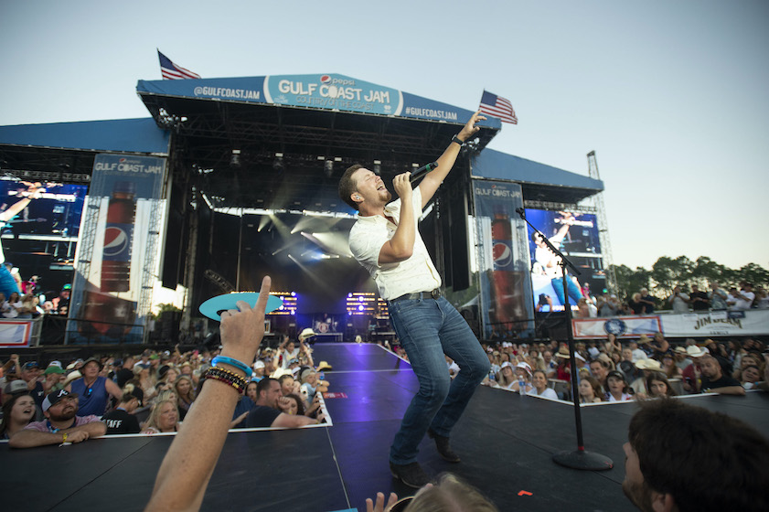 PANAMA CITY BEACH, FLORIDA - JUNE 05: Scotty McCreery performs during the Pepsi Gulf Coast Jam on June 05, 2022 in Panama City Beach, Florida.