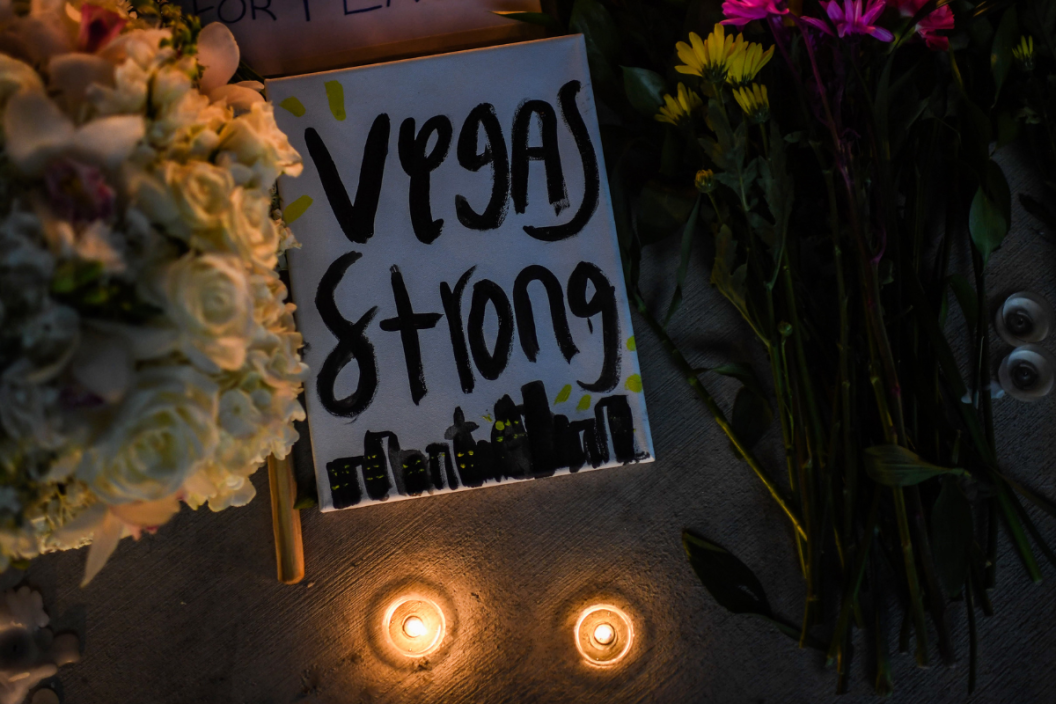 Flowers and signs are seen at a vigil that was held for the victims along the Las Vegas Strip a day after 59 people were killed and more than 500 wounded at the Route 91 Harvest Country Music Festival on Monday, October 2, 2017, in Las Vegas, NV. (Photo by Salwan Georges/The Washington Post via Getty Images)