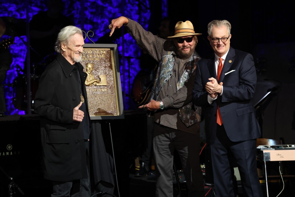 Kris Kristofferson and Hank Williams Jr. accept Country Music Hall of Fame and Museum induction on behalf of Jerry Lee Lewis presented by CEO of the Country Music Hall of Fame and Museum, Kyle Young at the class of 2022 Medallion Ceremony at Country Music Hall of Fame and Museum on October 16, 2022 in Nashville, Tennessee.