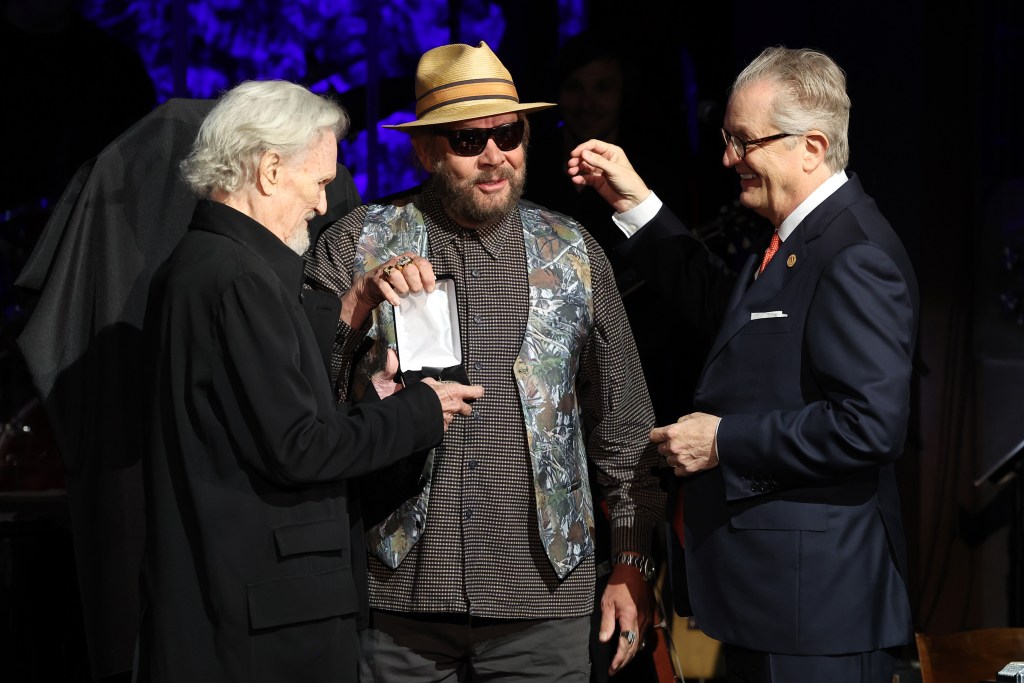 Kris Kristofferson and Hank Williams Jr. accept Country Music Hall of Fame and Museum induction on behalf of Jerry Lee Lewis presented by CEO of the Country Music Hall of Fame and Museum, Kyle Young at the class of 2022 Medallion Ceremony at Country Music Hall of Fame and Museum on October 16, 2022 in Nashville, Tennessee.