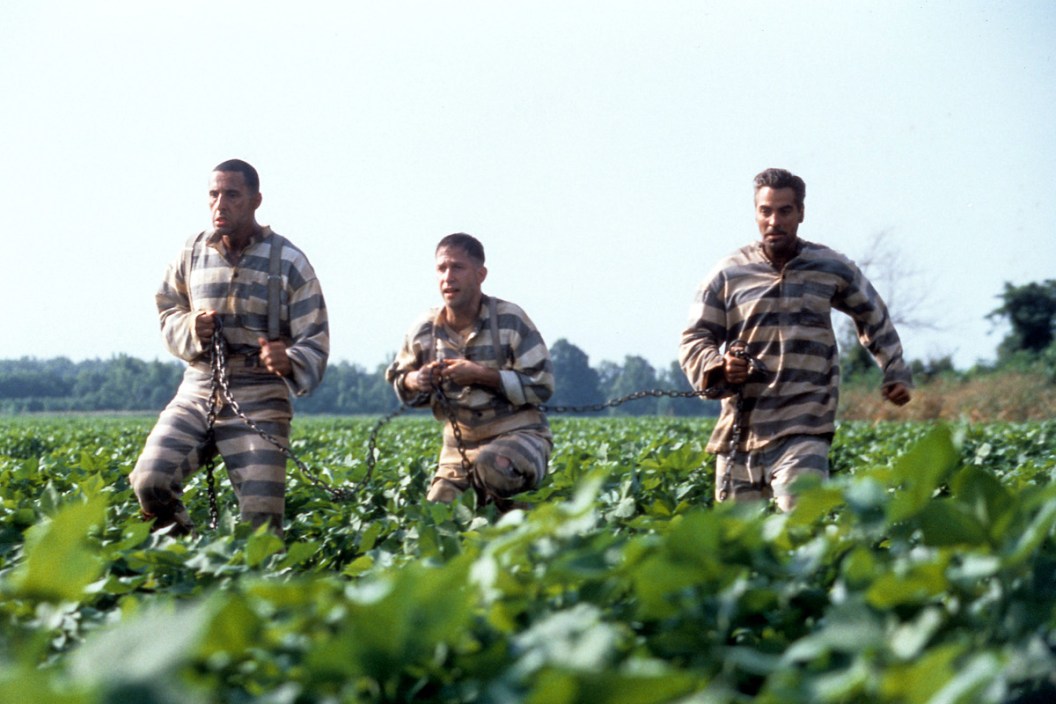John Turturro, Tim Blake Nelson and George Clooney run through a field in a scene from the film 'O Brother, Where Art Thou?', 2000. (