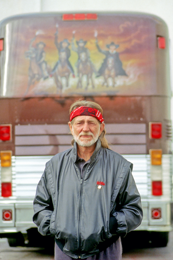 LAS VEGAS - CIRCA 1990: Country singer/songwriter Willie Nelson poses for a portrait with his bus "Honeysuckle Rose" outside the Mirage Casino in circa 1990 in Las Vegas, Nevada. 