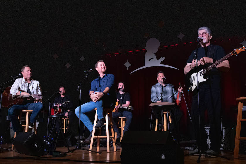 Press photo of Scotty McCreery (center) from the 2022 Country Cares Seminar.