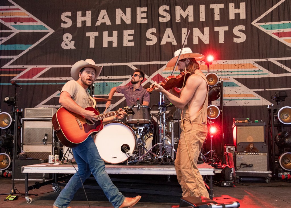 (L-R) Shane Smith, Bryan McGrath and Bennett Brown of Shane Smith & the Saints perform at Michigan Lottery Amphitheatre on May 21, 2022 in Sterling Heights, Michigan. 