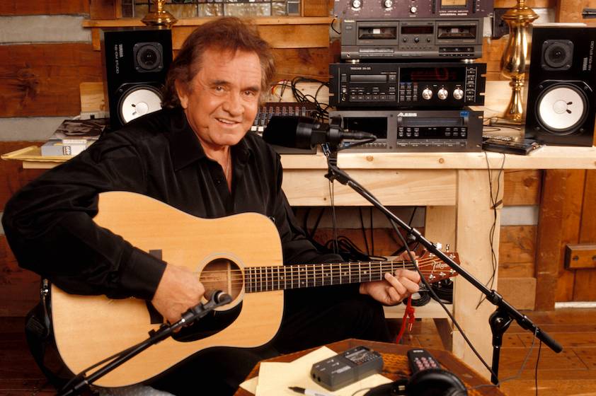 UNITED STATES - JANUARY 01: NASHVILLE Photo of Johnny CASH, Posed portrait of Johnny Cash, with Takamine acoustic guitar, recording in home studio 