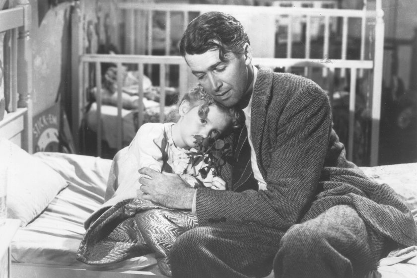 1946: American actor James Stewart (1908 - 1997) as George Bailey, hugs actor Karolyn Grimes, who plays Zuzu his daughter, in a still from director Frank Capra's Christmas classic film, 'It's a Wonderful Life'.
