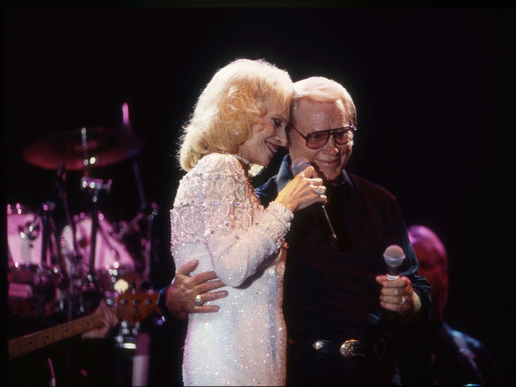 NASHVILLE -January 1: Country Music Singer Songwriter Tammy Wynette and George Jones performs at Fanfair on January 1, 1995 in Nashville, Tennessee 