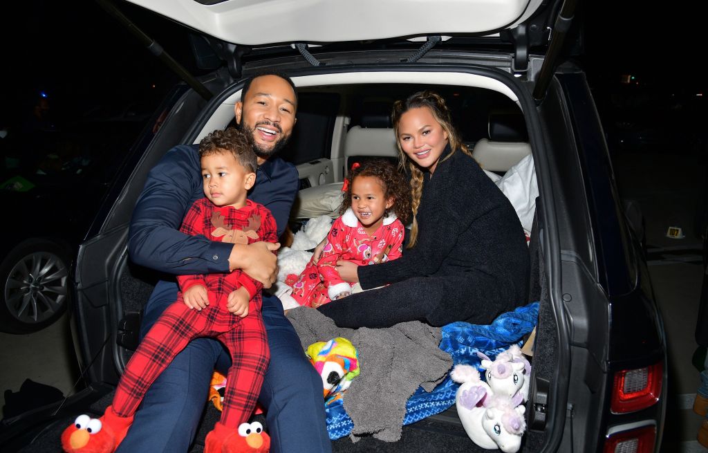  (L-R) Miles Theodore Stephens, John Legend, Luna Simone Stephens, and Chrissy Teigen attend Netflix's "Jingle Jangle: A Christmas Journey" drive-in premiere at The Grove on November 13, 2020 