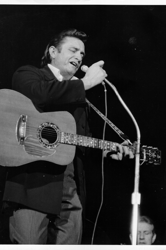 LOS ANGELES - 1968: Country singer/songwriter Johnny Cash performs onstage in 1968 in Los Angeles, California. 