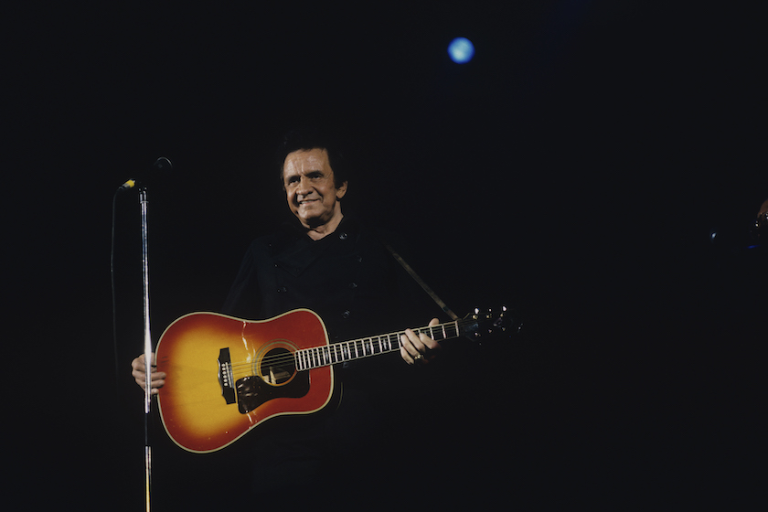 UNITED KINGDOM - JANUARY 01: American singer Johnny Cash performs on stage in 1991. 