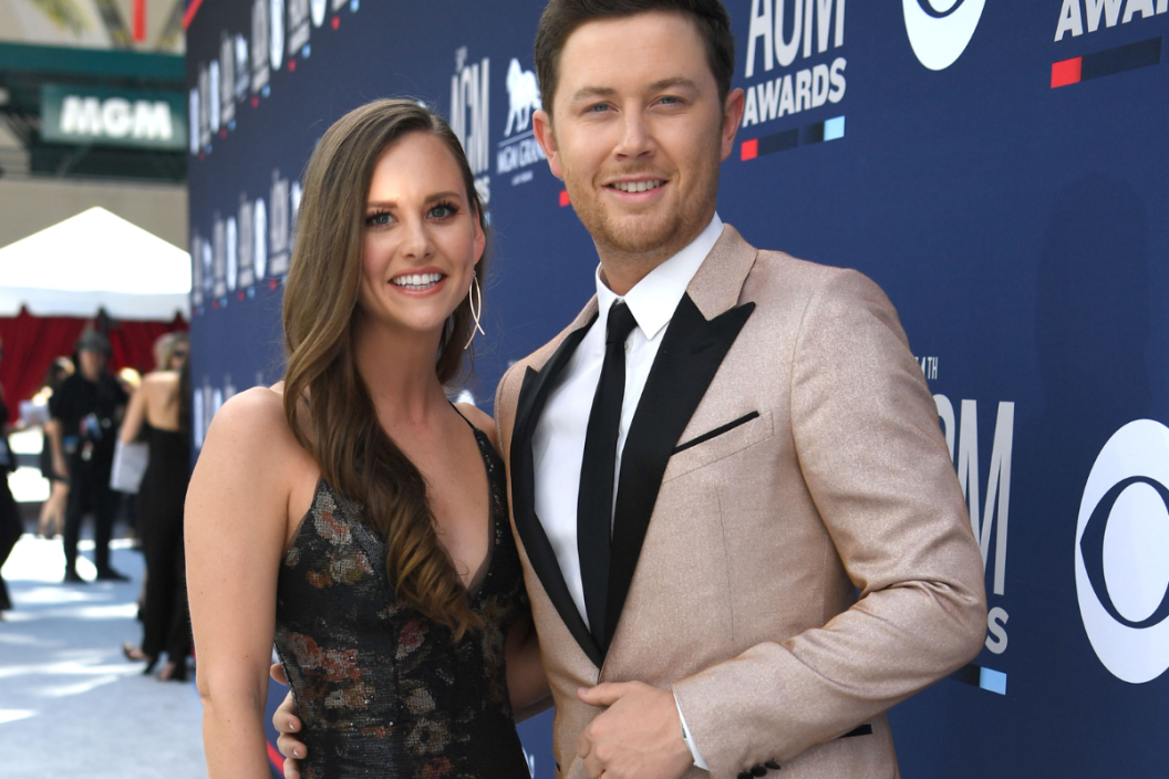 Scotty McCreery (R) and his wife Gabi Dugal attend the 54th Academy Of Country Music Awards at MGM Grand Hotel & Casino on April 07, 2019 in Las Vegas, Nevada.