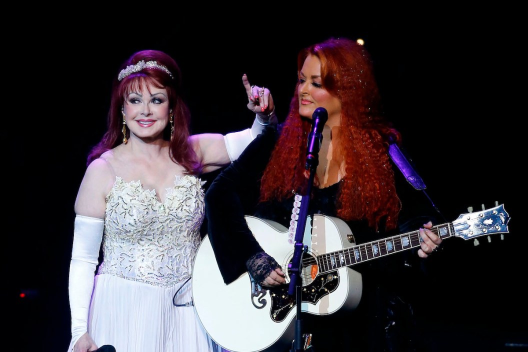 LAS VEGAS, NV - OCTOBER 07: Recording artists Naomi Judd (L) and Wynonna Judd perform during the launch of their nine-show residency "Girls Night Out" at The Venetian Las Vegas on October 7, 2015 in Las Vegas, Nevada.