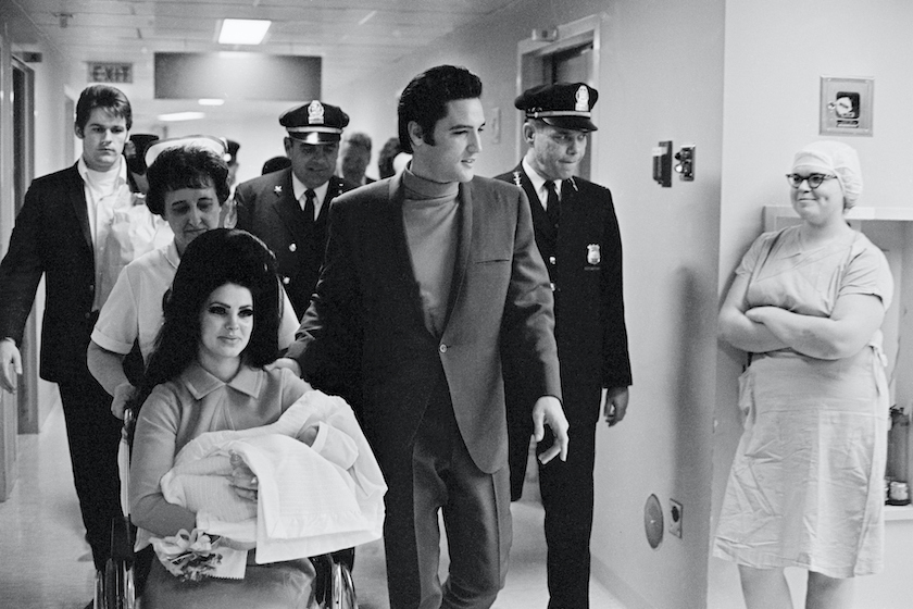 Lisa Marie Presley Photos (Original Caption) 2/7/1968-Memphis, TN: Evis Presley with his wife and daughter as they leave Baptist Hospital.