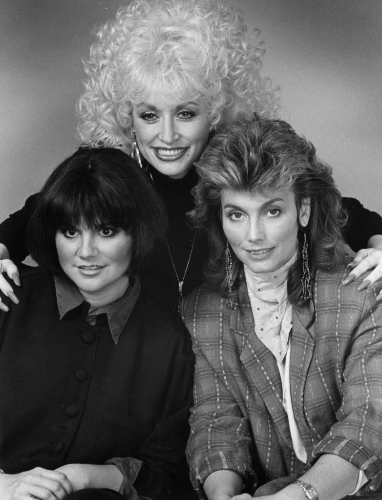 (left to right) singers Linda Ronstadt, Dolly Parton, and Emmylou Harris are shown in a photo session in Hollywood, California, at a Universal City hotel, promoting their album "Trio." Star Tribune photo March 13,1987, by Bruce Bisping.