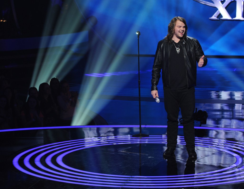 HOLLYWOOD, CA - FEBRUARY 19: Contestant Caleb Johnson performs onstage on FOX's "American Idol" Season 13 Men Perform Live Show on February 19, 2014 in Hollywood, California. 
