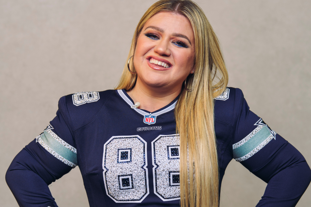 Kelly Clarkson poses for a photo while wearing a Dallas Cowboys dress during NFL Honors at the Symphony Hall on February 9, 2023 in Phoenix, Arizona.