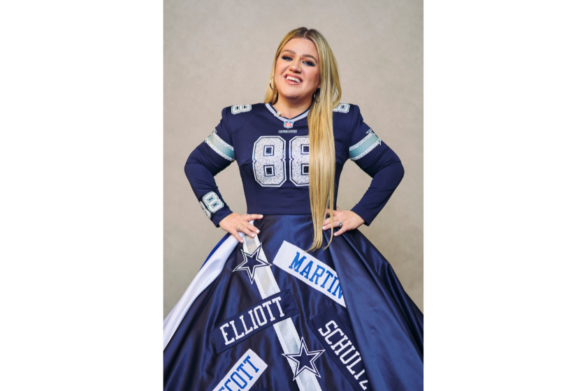 Kelly Clarkson poses for a photo while wearing a Dallas Cowboys dress during NFL Honors
